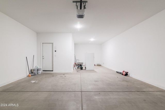 4702 S 109th Ave, Tolleson, AZ 85353 - garage featuring baseboards and a garage door opener