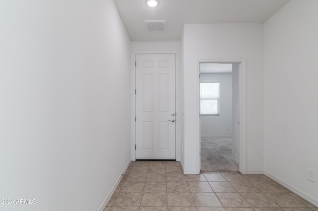 4702 S 109th Ave, Tolleson, AZ 85353 - hallway featuring light tile patterned flooring, visible vents, and baseboards
