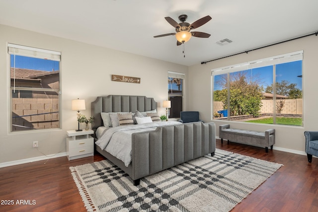 bedroom with ceiling fan and dark hardwood / wood-style floors