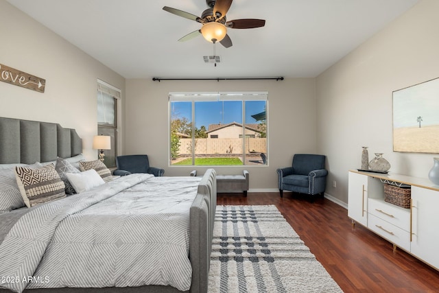 bedroom with dark hardwood / wood-style floors and ceiling fan