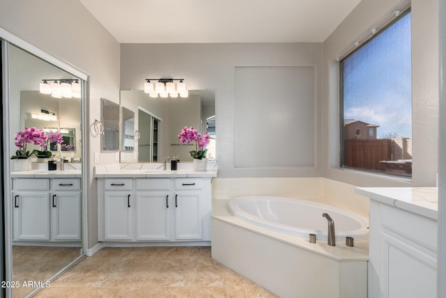 bathroom featuring vanity and a bathtub