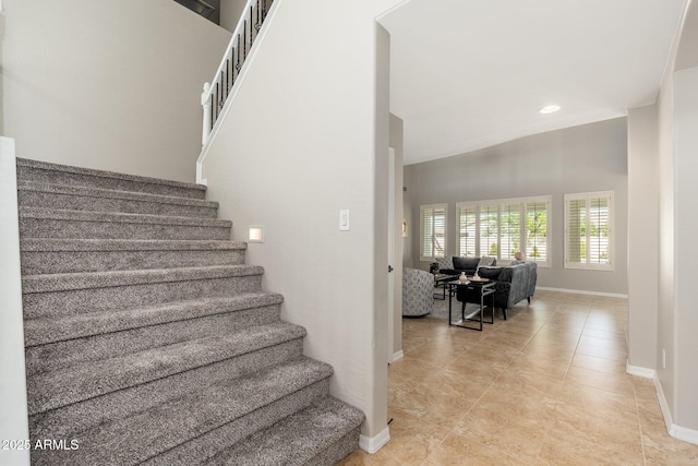 stairs featuring tile patterned flooring