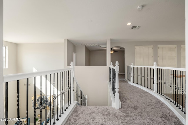 corridor with carpet flooring