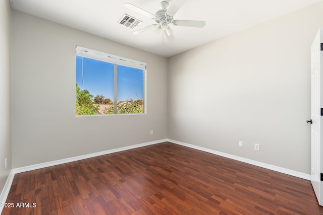 unfurnished room with dark wood-type flooring and ceiling fan