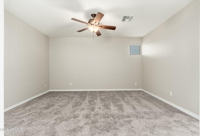 carpeted spare room featuring ceiling fan