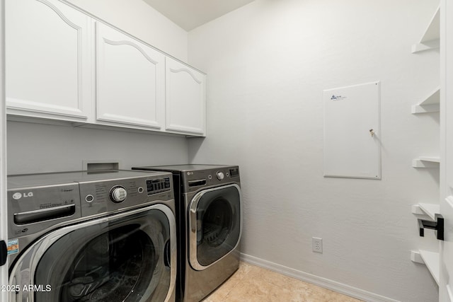 clothes washing area featuring cabinets, independent washer and dryer, and light tile patterned flooring