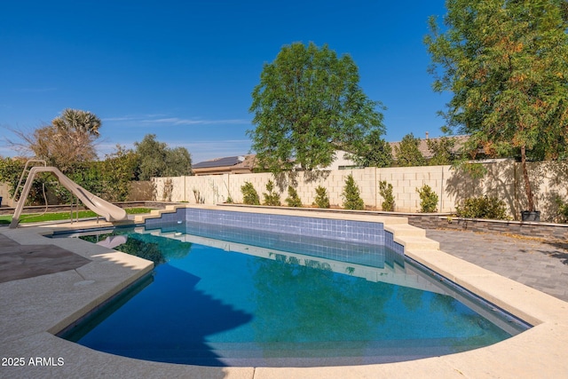 view of swimming pool featuring a water slide