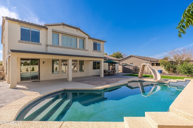 view of pool featuring a patio