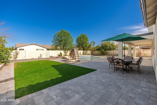 view of patio / terrace featuring a fenced in pool