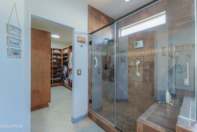 bathroom with tile patterned flooring and an enclosed shower