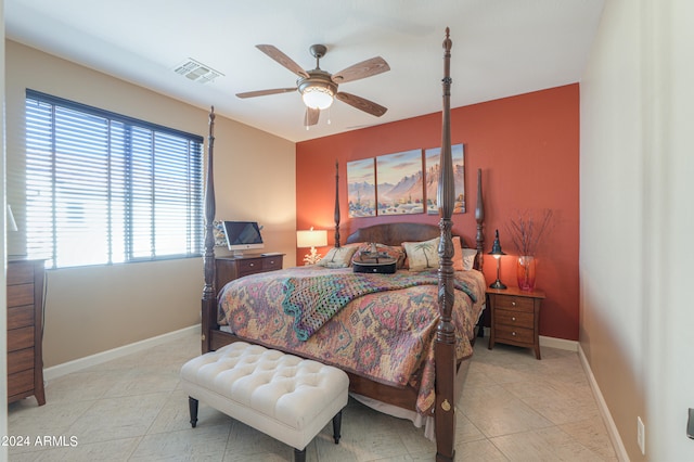 tiled bedroom with ceiling fan