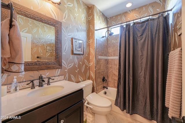 full bathroom featuring shower / bath combination with curtain, toilet, and vanity