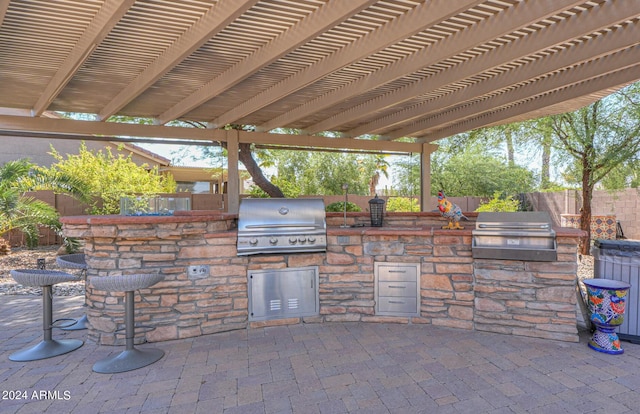 view of patio with area for grilling and grilling area