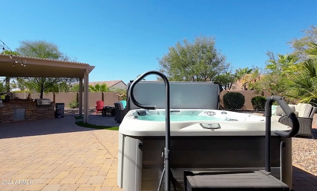 view of patio featuring a hot tub