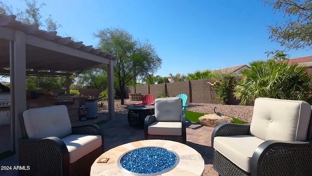 view of patio / terrace with an outdoor living space with a fire pit and a pergola