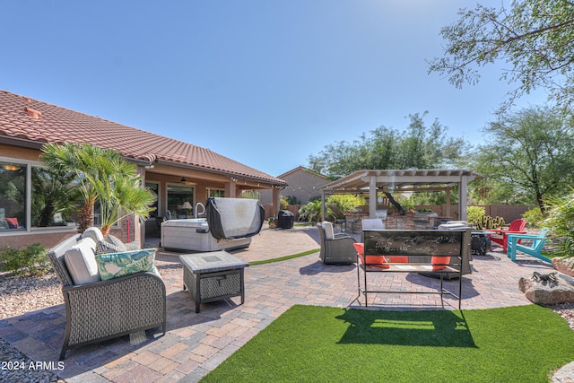 view of patio with a hot tub, an outdoor living space with a fire pit, and a pergola