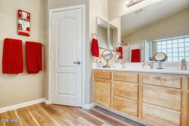 bathroom featuring vanity and hardwood / wood-style flooring