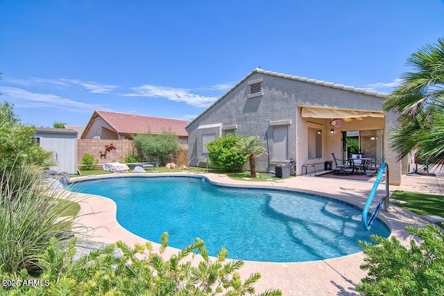 view of pool featuring a patio area