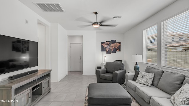 14870 W Encanto Blvd Unit 1059, Goodyear, AZ 85395 - living area with ceiling fan, light tile patterned floors, and baseboards