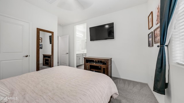 14870 W Encanto Blvd Unit 1059, Goodyear, AZ 85395 - bedroom with carpet, ensuite bath, and baseboards