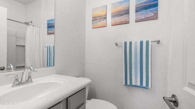 14870 W Encanto Blvd Unit 1059, Goodyear, AZ 85395 - bathroom with vanity, toilet, and a shower with shower curtain