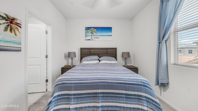 14870 W Encanto Blvd Unit 1059, Goodyear, AZ 85395 - bedroom featuring carpet flooring, multiple windows, a ceiling fan, and baseboards