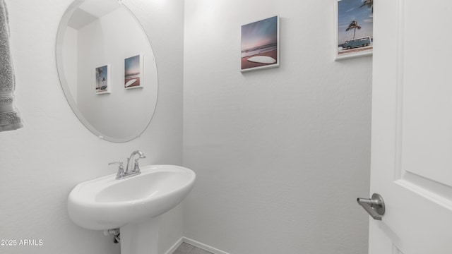 14870 W Encanto Blvd Unit 1059, Goodyear, AZ 85395 - bathroom featuring a sink and baseboards