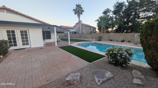 1044 N Arvada N, Mesa, AZ 85205 - view of swimming pool with french doors, a patio, and a fenced backyard