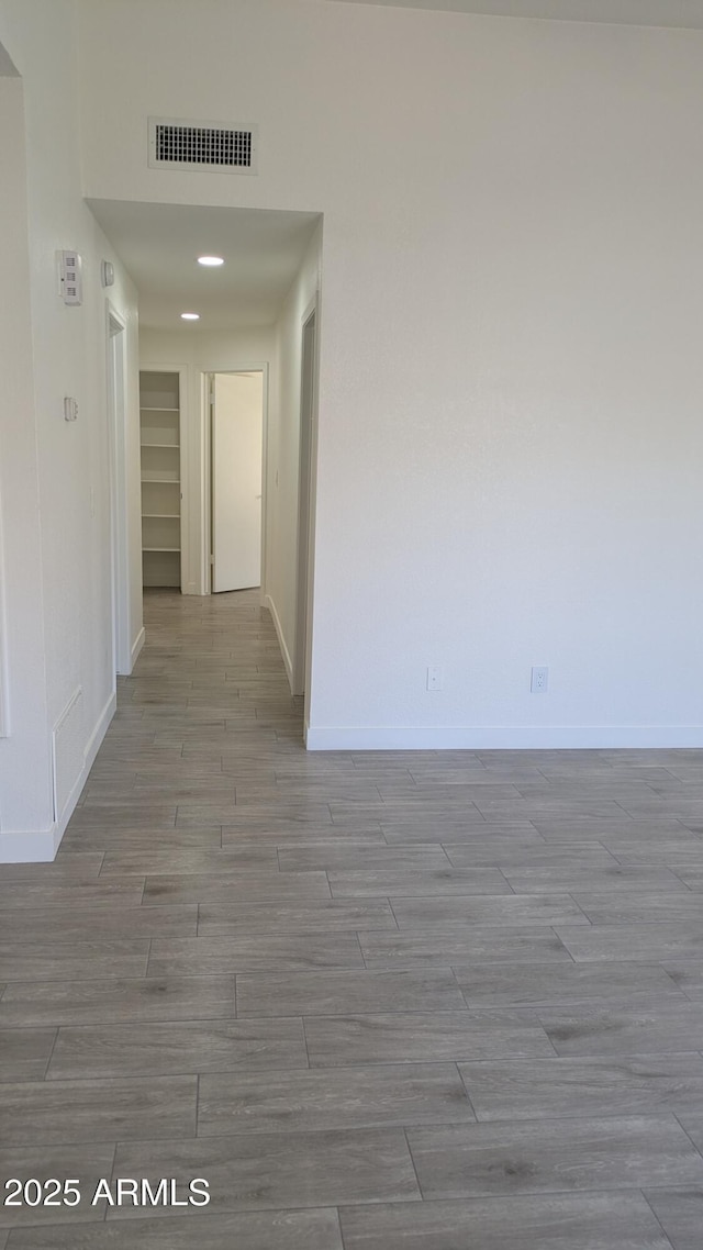 1044 N Arvada N, Mesa, AZ 85205 - corridor featuring baseboards and wood finished floors