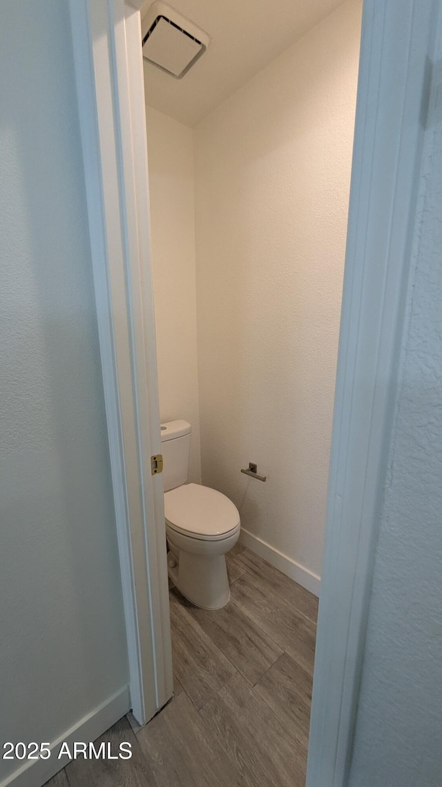 1044 N Arvada N, Mesa, AZ 85205 - bathroom featuring wood finished floors and toilet