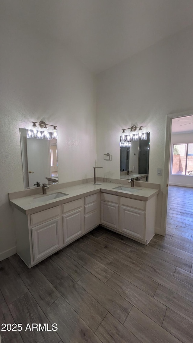 1044 N Arvada N, Mesa, AZ 85205 - bathroom featuring wood tiled floors and double vanity