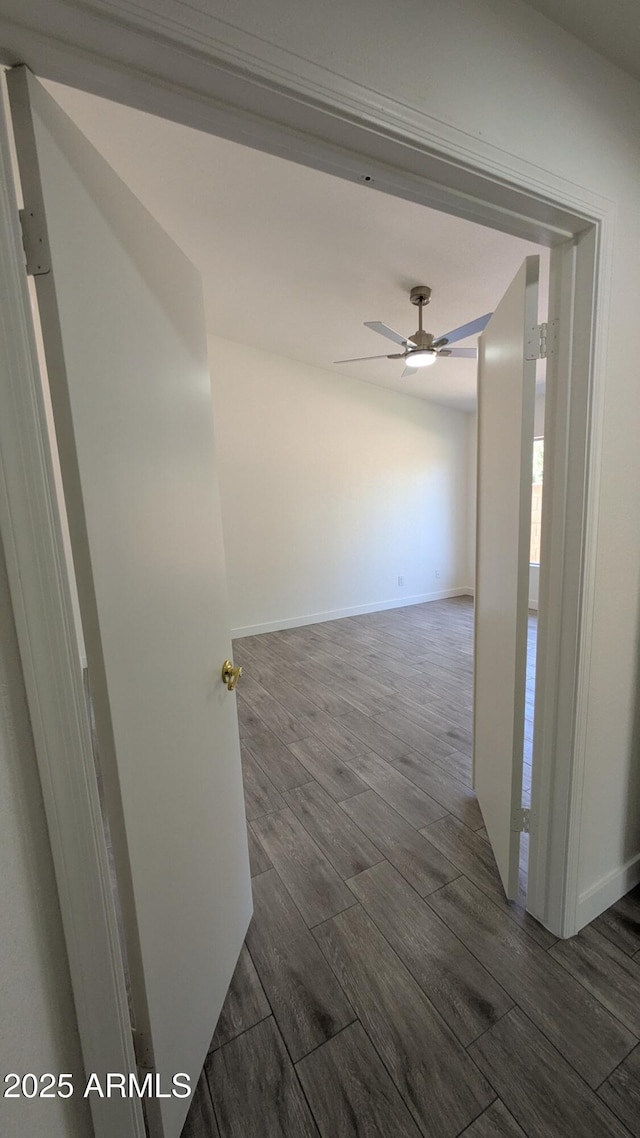 1044 N Arvada N, Mesa, AZ 85205 - hall featuring dark wood-style flooring and baseboards