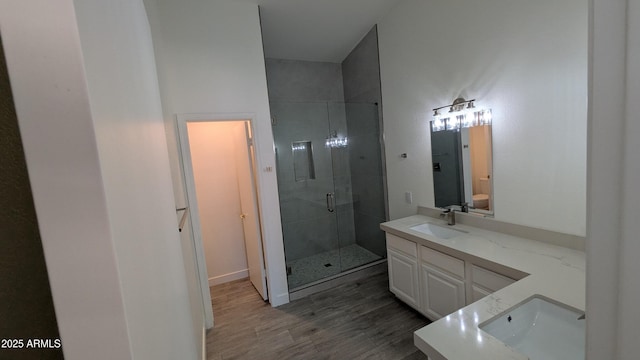 1044 N Arvada N, Mesa, AZ 85205 - bathroom with vanity, a shower stall, and wood finished floors