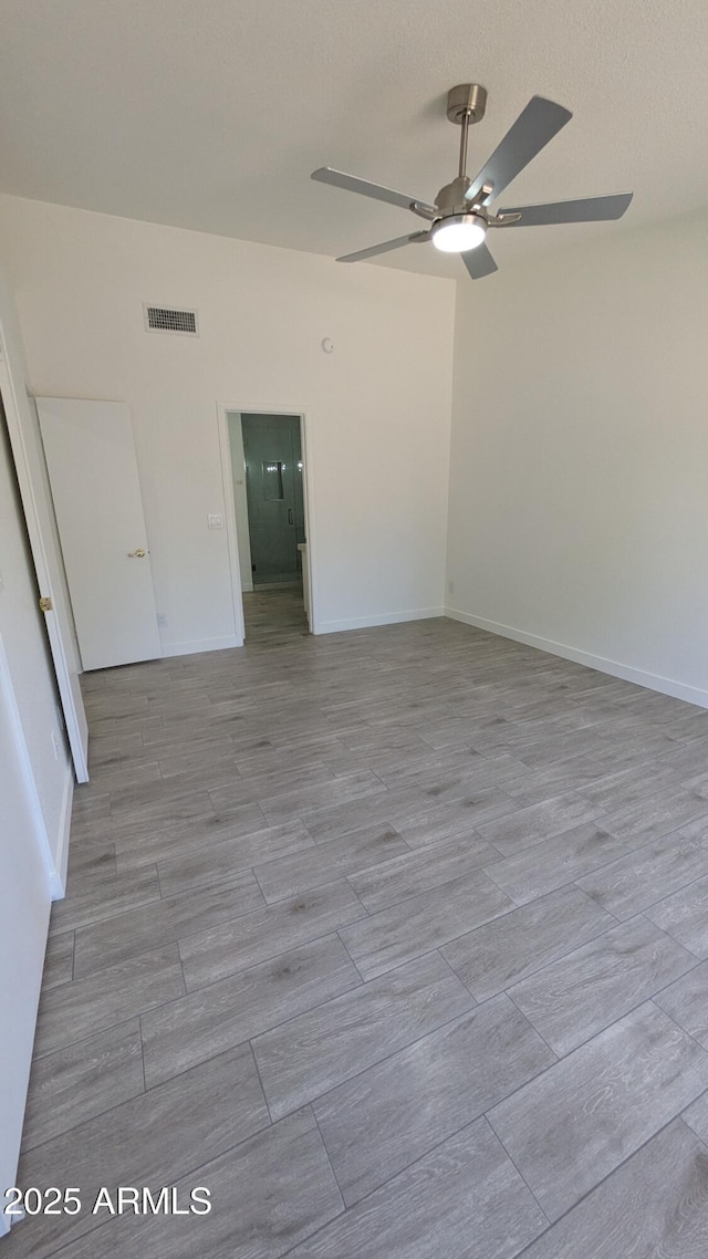 1044 N Arvada N, Mesa, AZ 85205 - unfurnished room with ceiling fan and baseboards