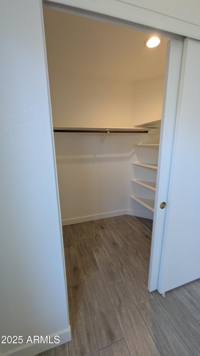 1044 N Arvada N, Mesa, AZ 85205 - walk in closet featuring wood finished floors
