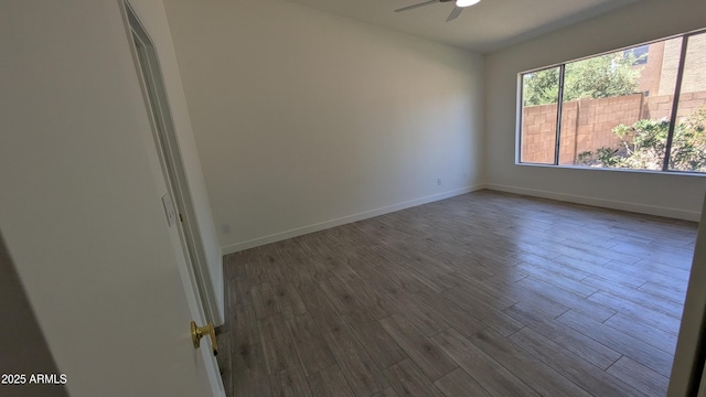1044 N Arvada N, Mesa, AZ 85205 - empty room with a ceiling fan and dark wood-style floors