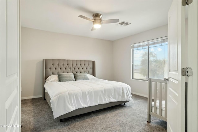 bedroom with ceiling fan, baseboards, visible vents, and dark colored carpet