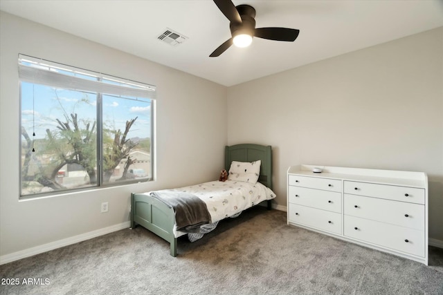 bedroom featuring light carpet, baseboards, visible vents, and a ceiling fan