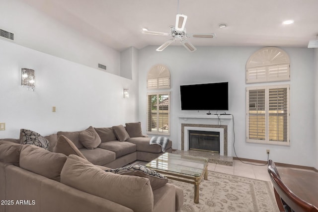 9414 S La Rosa Dr, Tempe, AZ 85284 - tiled living area with ceiling fan, a high end fireplace, and high vaulted ceiling