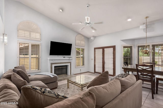 9414 S La Rosa Dr, Tempe, AZ 85284 - living room featuring a ceiling fan, lofted ceiling, light tile patterned flooring, a high end fireplace, and recessed lighting