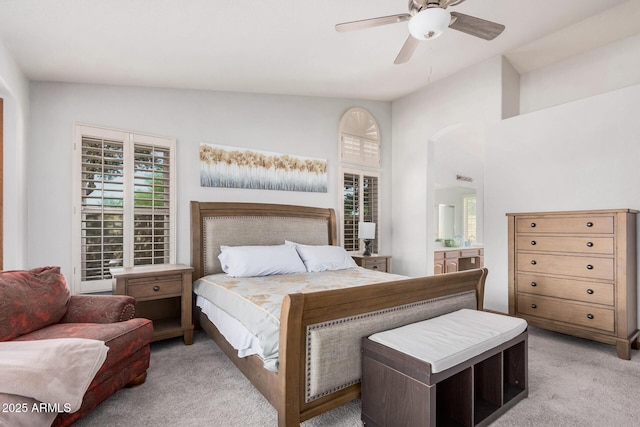 9414 S La Rosa Dr, Tempe, AZ 85284 - bedroom with light carpet, multiple windows, a ceiling fan, ensuite bathroom, and vaulted ceiling
