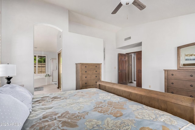 9414 S La Rosa Dr, Tempe, AZ 85284 - bedroom featuring vaulted ceiling, arched walkways, and ensuite bath