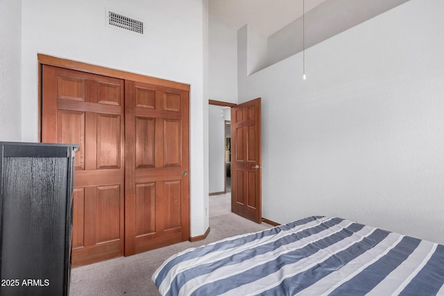 9414 S La Rosa Dr, Tempe, AZ 85284 - bedroom with light carpet, a towering ceiling, and baseboards