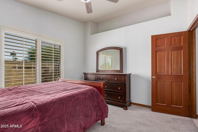 9414 S La Rosa Dr, Tempe, AZ 85284 - bedroom with light colored carpet, multiple windows, a ceiling fan, and baseboards