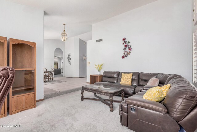 9414 S La Rosa Dr, Tempe, AZ 85284 - living room with arched walkways, lofted ceiling, and carpet floors