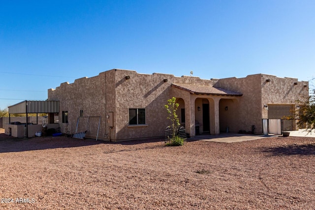 view of front of house with a patio area