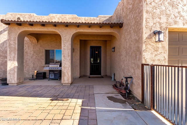 property entrance with a patio area