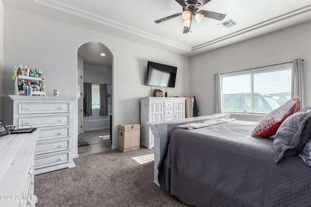 bedroom with ceiling fan and dark carpet