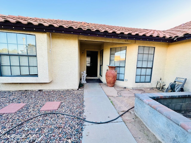 entrance to property with a patio