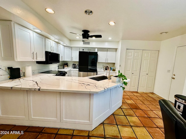 kitchen featuring white cabinets, kitchen peninsula, black appliances, ceiling fan, and sink